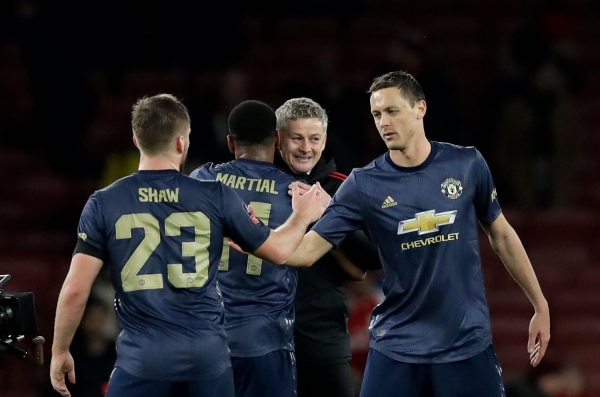 Ole Gunnar Solskjær kunne smile bedt etter Manchester Uniteds 3-1-seier borte mot Arsenal i FA-cupen.